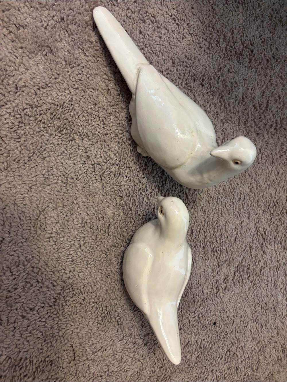 vintage white porcelain or ceramic dove figurines.